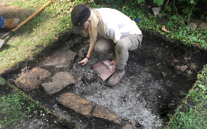 A volunteer archaeologist in the second excavation unit 