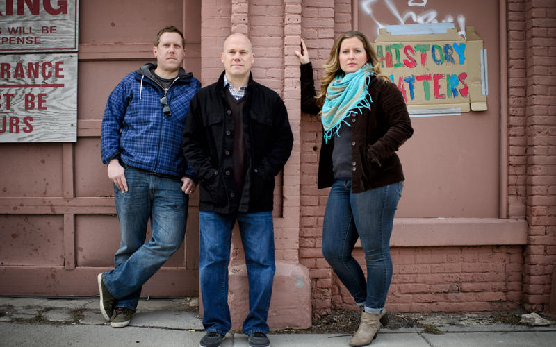 Mark Fangmeier, Tom Brock, and Elyse Jensen standing in front of Hope Engine Co. no. 3 during the March 2016 rally