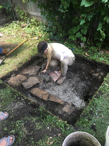 A volunteer archaeologist in the second excavation unit 